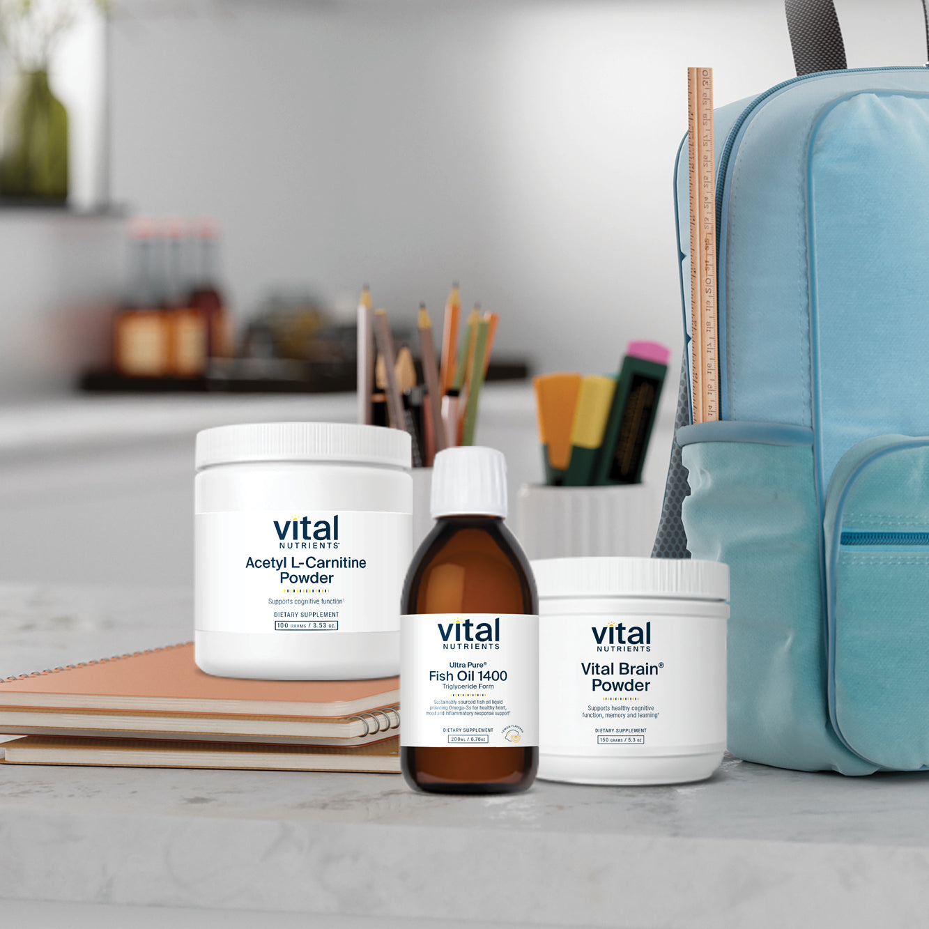 Vital brand supplements on a table with a backpack in the background